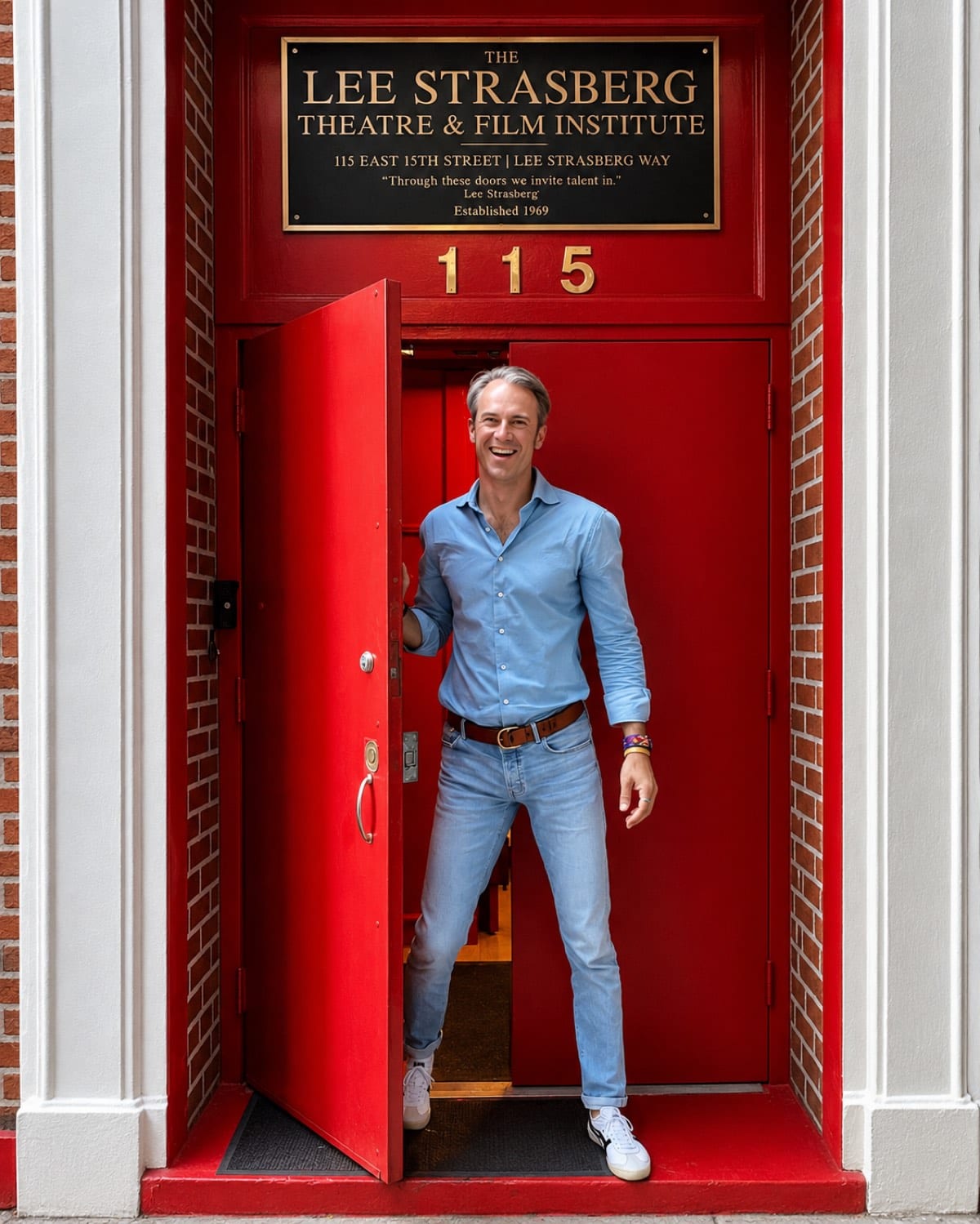 Jan Bruch in the open red doorway of the Lee Strasberg Theatre and Film Institute, New York.